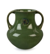 MOORCROFT "Flamminian" ware green glazed pottery vase with foliate&nbsp;roundel and two handles, circa 1905-1915, impressed mark "Moorcroft, Burslem" with green underglaze signature "W. Moorcroft", 20.5cm high