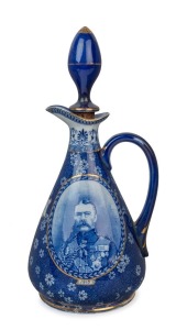 "JAS. WATSON & Co. Ltd. DISTILLERS EST.D 1815 CENTENARY SOUVENIR" English porcelain decanter with vignettes of Lord Kitchener and the Duke of Wellington, circa 1915, 29cm high