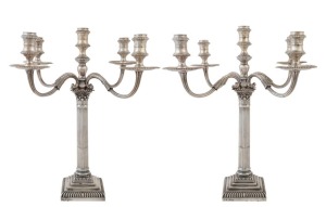 An impressive pair of English sterling silver five branch candelabra by William Gibson and John Langman of London, circa 1896, 43cm high, weighted bases.