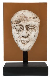 Egyptian male face mask, terracotta overlaid with plaster rendered in typical Hyksos style with large almond shaped eyes, heavy cosmetic lines, broad nose, arching brows and a full set lips. Traces of brown pigment still remaining. Hyksos Period, 15th to 16th dynasty, circa 1720-1570 B.C. 13cm high, 22cm overall