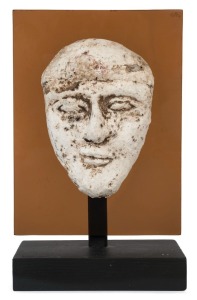 Egyptian male face mask, terracotta overlaid with plaster rendered in typical Hyksos style with large almond shaped eyes, heavy cosmetic lines, broad nose, arching brows and a full set lips. Traces of brown pigment still remaining. Hyksos Period, 15th to 