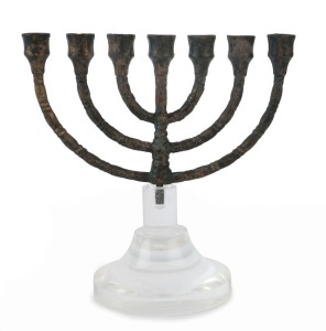 A bronze Menorah lamp stand of classic form with six curved branches and the seventh lamp atop the central pillar. The original base lost in antiquity, the shank that would have joined the body to the base cast in square form. Central Turkey, circa 15th t