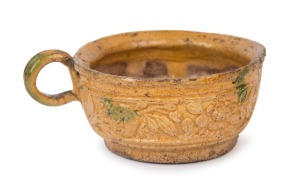 An antique Chinese ceramic teacup glazed in yellow and green, Ming dynasty, 15th/16th century, 4.5cm high, 11.5cm wide