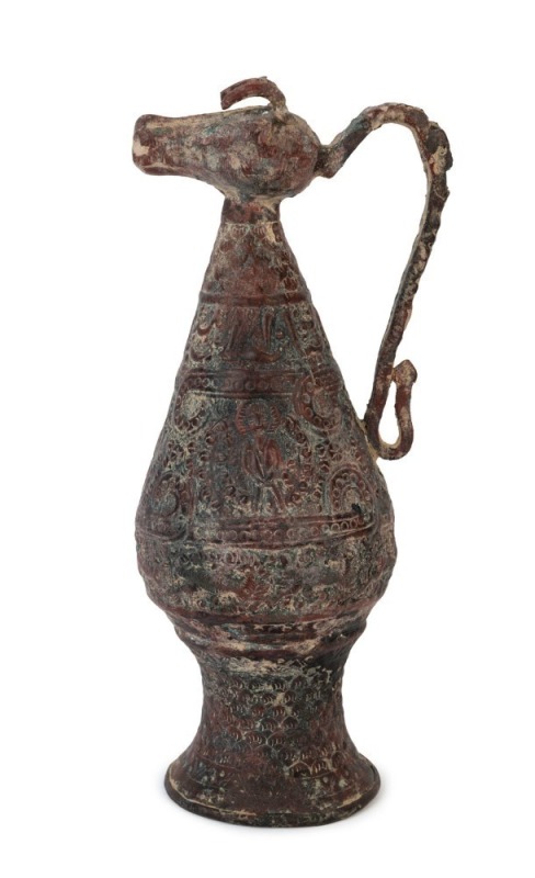 An antique Indo-Persian embossed metal jug with cow pouring spout, ​​​​​​​30cm high