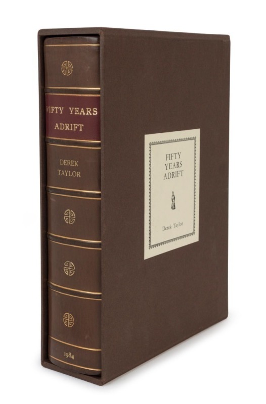 DEREK TAYLOR, GEORGE HARRISON, Fifty Years Adrift, [Genesis Publications, 1984], original half calf, spine gilt with raised bands, morocco spine label, gilt and coloured signet on front cover and author's signature gilt stamped on back cover. (x, 546pp.).