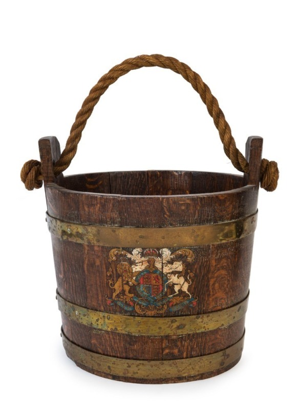 An antique oak and brass bucket of coopered construction with rope handle and hand-painted crest, 19th century, ​​​​​​​32cm high