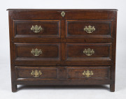 An antique English oak mule chest with ogee moulded blind drawer fronts, lift-top and single drawer, and peg joint construction, mid 18th century, 86cm high, 112cm wide, 52cm deep