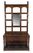 GILLOWS & Co. MANUFACTURERS LANCASTER fine antique walnut hallstand with brass and horn hooks and bevelled mirror, late 19th century, stamped with design number "L7931" underneath front rail and "Gillow & Co. Lancaster" on each side rail. Originally a sho