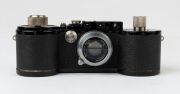 LEITZ: Leica 250 Reporter (GG) 35mm Rangefinder camera [#150164 series], 1943, with Summar f2 50mm lens [#335133], with both film magazines and shutter speed to 1000. - 3