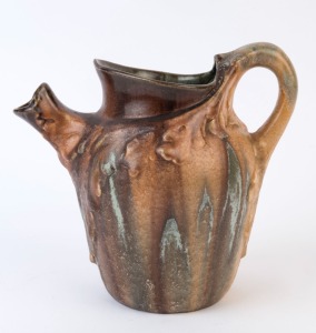 A Belgian brown glaze pottery jug with oak leaf decoration, circa 1930, 18cm high