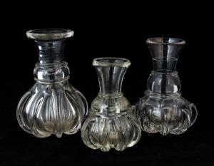 Three antique English glass whisky dram measures, 18th century, the largest 12cm high