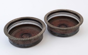 A pair of reproduction silver plated wine bottle coasters, mid 20th century, ​​​​​​​5cm high, 16cm diameter