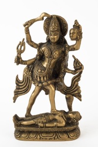 An Indian cast bronze statue of Kali, 20th century, 24cm high