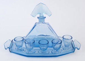 A Bohemian Art Deco blue glass decanter, tray and 5 liqueur glasses, circa 1930, the decanter 20.5cm high