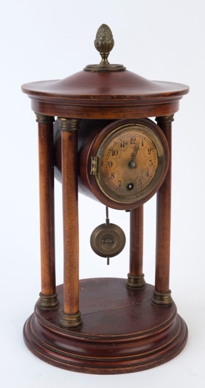 An antique mantel clock, timepiece only in cylindrical timber case with turned columns and gilt metal acorn finial, 19th/20th century, ​​​​​​​32cm high