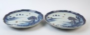 Pair of Chinese porcelain platters with underglaze blue landscape decoration, red borders and gilded highlights, early 20th century, 31.5cm wide - 2