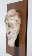 Egyptian male face mask, terracotta overlaid with plaster rendered in typical Hyksos style with large almond shaped eyes, heavy cosmetic lines, broad nose, arching brows and a full set lips. Traces of brown pigment still remaining. Hyksos Period, 15th to - 2