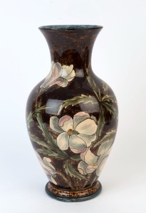 DOULTON LAMBETH art pottery vase decorated with magnolias, 19th century, stamped "Doulton Lambeth, Faience, 1877", with additional artist's monogram, 34cm high