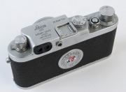 LEITZ: Leica 111g 35mm rangefinder camera [#828793], 1956, with Summicron 50mm, f2 screw-mount collapsible lens [#1266849] in maker's ERC with Leica Guide and Agfalux flash. - 2