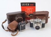 LEITZ: Leica 111g 35mm rangefinder camera [#828793], 1956, with Summicron 50mm, f2 screw-mount collapsible lens [#1266849] in maker's ERC with Leica Guide and Agfalux flash. - 3