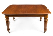 An antique mahogany two leaf extension dining table with turned and fluted legs, 19th century, 75cm high, 158cm (extends to 248cm) wide, 113cm deep