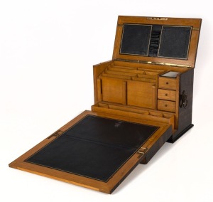 An antique English desk compendium, beautifully crafted in coromandel with oak interior fitted with compartments and tooled leather writing slope, mid 19th century, missing lock and escutcheon, 27cm high, 41cm wide, 21cm deep