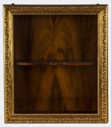 A shadow box wall cabinet with gilt framed door, 20th century, 67cm high, 56cm wide, 20cm deep