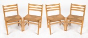 A set of four Scandinavian beech dining chairs with woven rush seats, 83cm high