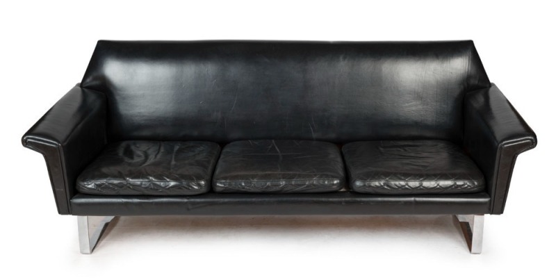 A vintage black leather three seat settee with chrome skid base, circa 1965, 96cm across the arms