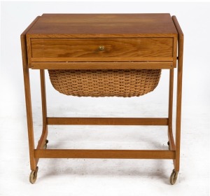 A vintage Danish teak worktable, single drawer and wicker undercarriage, circa 1970s, ​​​​​​​60cm high, 55cm wide, 36cm deep