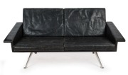 A retro black leather two seat settee with splayed chrome legs, ​​​​​​​166cm across the arms