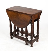 An antique English oak oval drop-side gate-leg occasional table, 19th/20th century, 71cm high, 39cm (extends to 103cm) wide, 75cm deep - 2