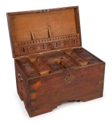 An Anglo-Indian teak travel trunk, interior attractively fitted with lift-out tray and carved compartments, with original brass escutcheons and bindings, a very attractive piece, early 19th century. 50cm high, 82cm wide, 48cm deep