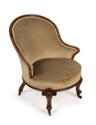 An antique English walnut armchair with olive green velvet upholstery, 19th century, 84cm high, 68cm across the arms