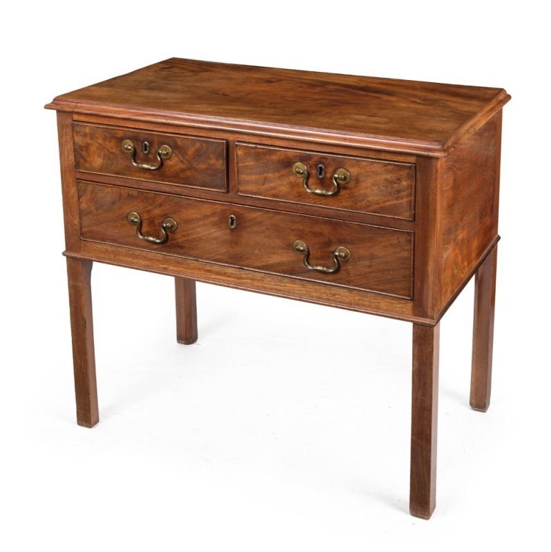 A Georgian three drawer mahogany low boy with cockbeaded drawers and brass swan neck handles, circa 1800, 72cm high, 80cm wide, 45cm deep