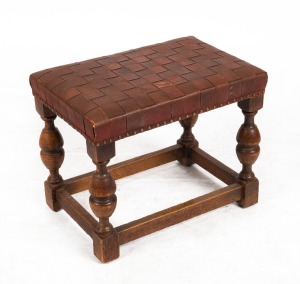 An English oak Elizabethan style stool with plaited leather top, early 20th century, ​​​​​​​38cm high, 46cm wide, 31cm deep