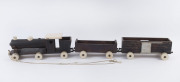 A depression era folk art toy pull-along locomotive and tender, circa 1930, ​74cm long