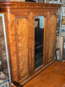 An antique Australian huon pine three door wardrobe with Australian cedar interior fitted with linen slides and drawers, 19th century, 220cm high, 212cm wide, 72cm deep