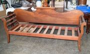 An antique Colonial Australian cedar miner's couch with rolling pin back, impressively grained solid cedar backboard, circa 1860, 91cm high, 202cm across the arms, 61cm deep
