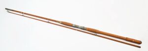 An Australian vintage split cane fishing rod, stamped "Pastime Len C. Butterworth, Rod Maker, Brisbane" 274cm overall