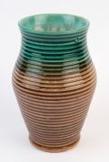 BENDIGO POTTERY, two green and brown glazed vases with ribbed decoration, stamped "No.13", and "BENDIGO POTTERY No.18", ​​​​​​​21cm high - 2