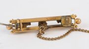 A Colonial 15ct yellow gold double bar brooch with gold nugget specimens, 19th century, ​​​​​​​stamped "15ct", 4cm wide, 4.9 grams - 5