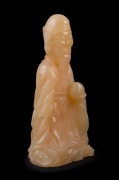 A Chinese carved stone statue of an immortal, 19th/20th century, ​​​​​​​19cm high