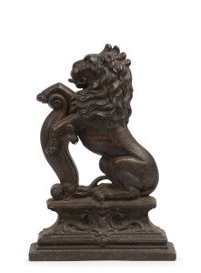 Windsor Hotel Melbourne cast iron doorstop showing a rampant lion, 19th century, 38cm high