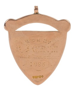 "MANCHESTER GEORGE" 9ct rose gold trophy fob, engraved "Won By R.H. GLEDHILL, Mile Championship, 1895", stamped "375", 4.5cm high, weight 21gr.