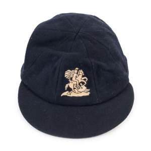 GRAHAM MCKENZIE COLLECTION - 1962-63 ASHES SERIES: English Cricket Cap in deep blue with embroidered 'George & Dragon' on front worn by wicket-keeper Alan (A.C.) Smith during the series and exchanged with Graham McKenzie. The names of both cricketers are 