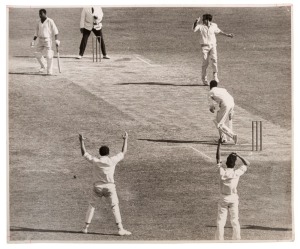 GRAHAM MCKENZIE COLLECTION - 1968-69 WEST INDIES TOUR OF AUSTRALIA: Two large photos (each 24x29cm) recording the occasion of McKenzie's 200th Test Wicket trapping Gary Sobers lbw in the West Indies 2nd Innings,the first photo showing McKenzie appealing with Sobers trapped on his crease, the second image showing McKenzie being congratulated by his team mates after the fall of the wicket, both images signed by McKenzie on reverse; some edge blemishes.