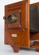 Thornton-Pickard: Enlarger, painted tin and mahogany bearing ivorine plaque "Thornton-Pickard Artist Enlarger, Altringham", with original lens by Taylor, Taylor & Hobson [#18269],45cm high, 80cm long - 2