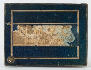 NORTH MELBOURNE FOOTBALL CLUB: 1888 Member's Ticket in blue leather with cream leather straps on front and reverse embossed in gold 'N.M.F.C./Season 1888', with borders in gilt. The interior page lists 'FIRST TWENTY' & 'SECOND TWENTY' engagements, the inside back cover with full printed page with details of the club Patrons, President, Vice-Presidents, General Committee and Match Committee.