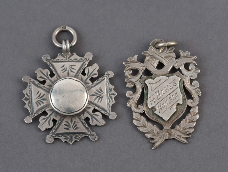 ENGLISH CRICKET CLUB sterling silver award fobs: 1908-9 Stanley United C.C. and 1912-13 C.B.C.C., (2 items).